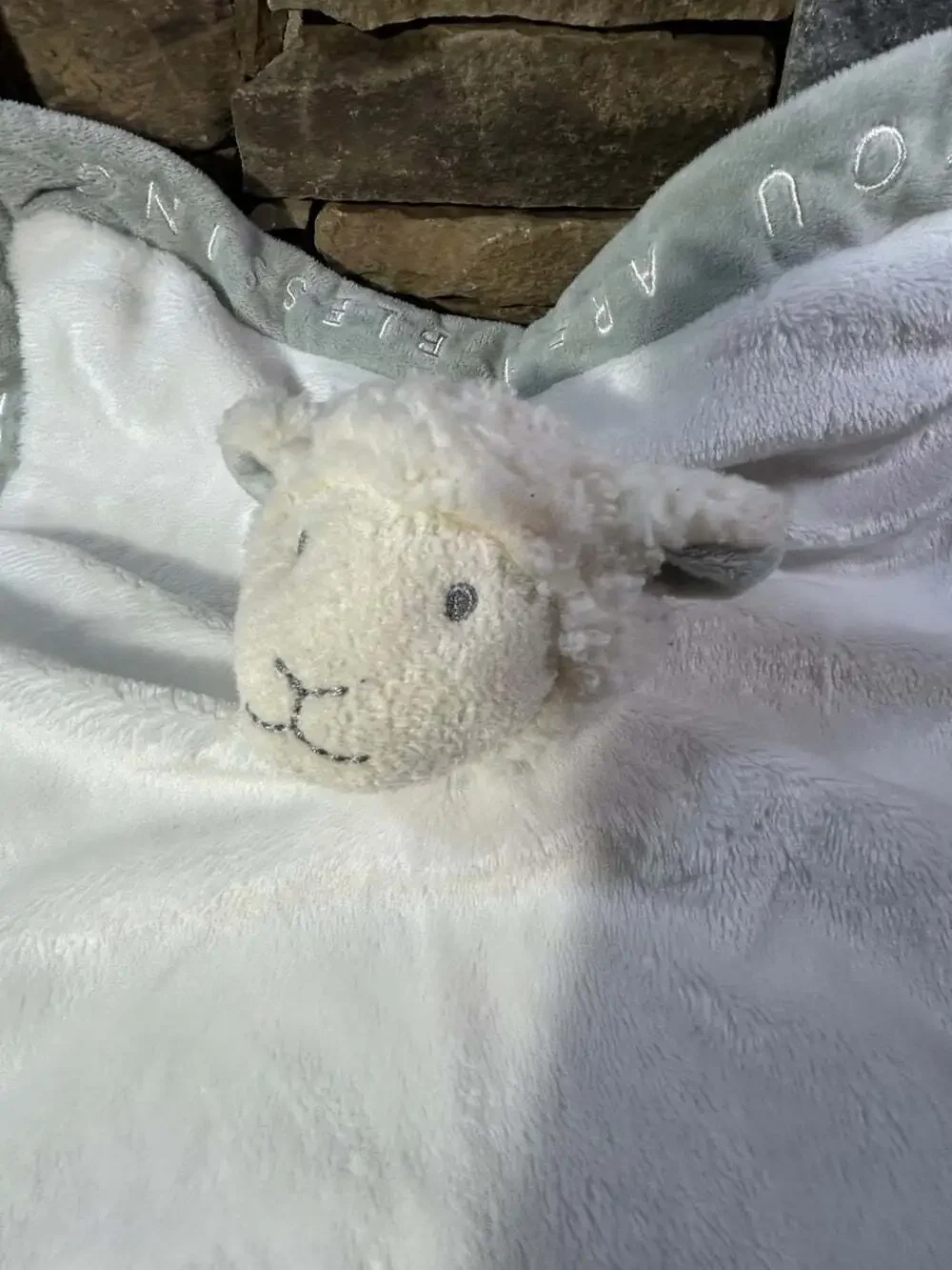 Grasslands Road white lamb sheep lovey with writing on edges